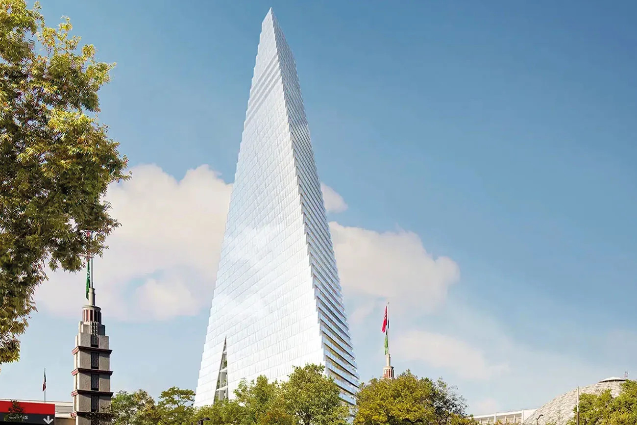 La tour Triangle à Paris, silhouette pyramidale de verre entre les arbres, où ouvrira BO&MIE Triangle